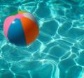 Pool with beach ball by Raphaël Biscaldi on Unsplash