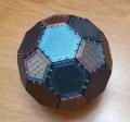 A spheroid made of pentagonal and hexagonal panels