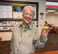 Older adult holding painted rock