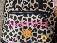Leopard spotted backpack with buttons and patches