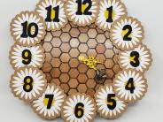 Wooden clock with flowers, honeycomb and bee