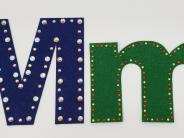 Upper case and lower case M in felt