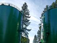 Photo of two large green water reservoirs