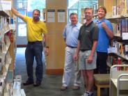 WelchAllyn  employees shifting the nonfiction collection in the library