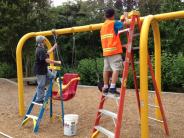 Cleaning play structure at Tualatin Community Park