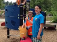 Cleaning play structure at Tualatin Community Park
