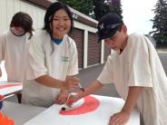 Preparing the cake for the Crawfish Festival City float