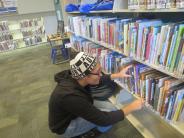 Volunteer Sprucing Up Tualatin Library