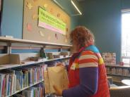 Volunteer Sprucing Up Tualatin Library