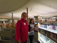 Volunteer shelving books