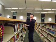 Volunteer shelving books