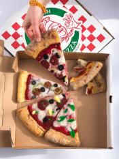 Pizza made of felt in a pizza box