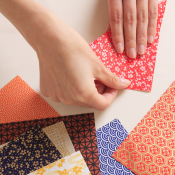 Hands folding paper