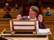 Julian Perkins performing at the harpsichord
