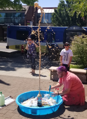 An explosion of Coke and Mentos in a kiddie pool on the library plaza