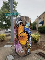 image of a traffic signal box wrapped with art