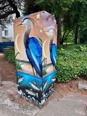 image of a traffic signal box wrapped with art