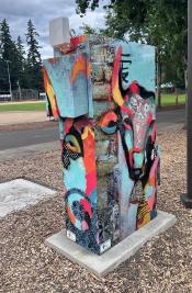 image of a traffic signal box wrapped with art