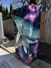 image of a traffic signal box wrapped with art