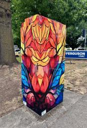 image of a traffic signal box wrapped with art