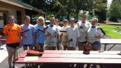 TEAM scrubs, sands, and paints picnic tables for Tualaitn's parks