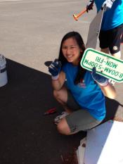 TEAM member holding a sign