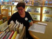 Volunteer sorting books 