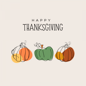 Happy Thanksgiving text with three pumpkins