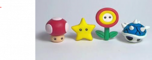 Mario mushroom, star, fire flower and blue shell made from polymer clay