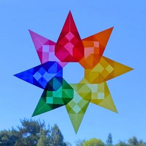 Photo of colorful star made from folded paper.