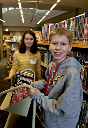 Photo of Tweens volunteering at the library.