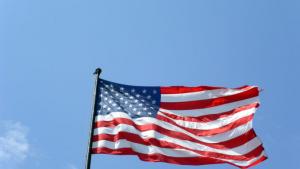 Photo of flag on blue sky background