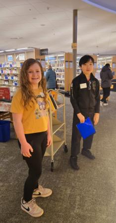 Photo of two tweens at a precious takeover. 