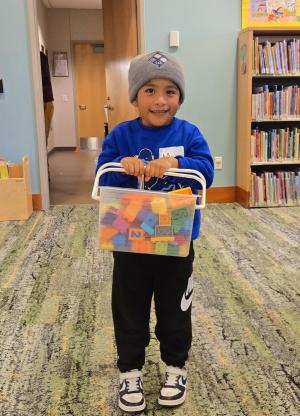 Max, a little spruce up volunteer, who helps to clean the kids' room lego blocks.