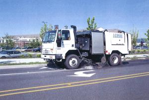 Photo of a street sweeper truck.