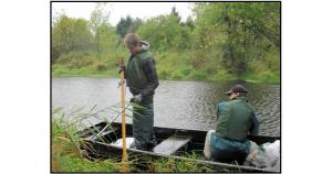 Using boat to clean up Hedges Creek