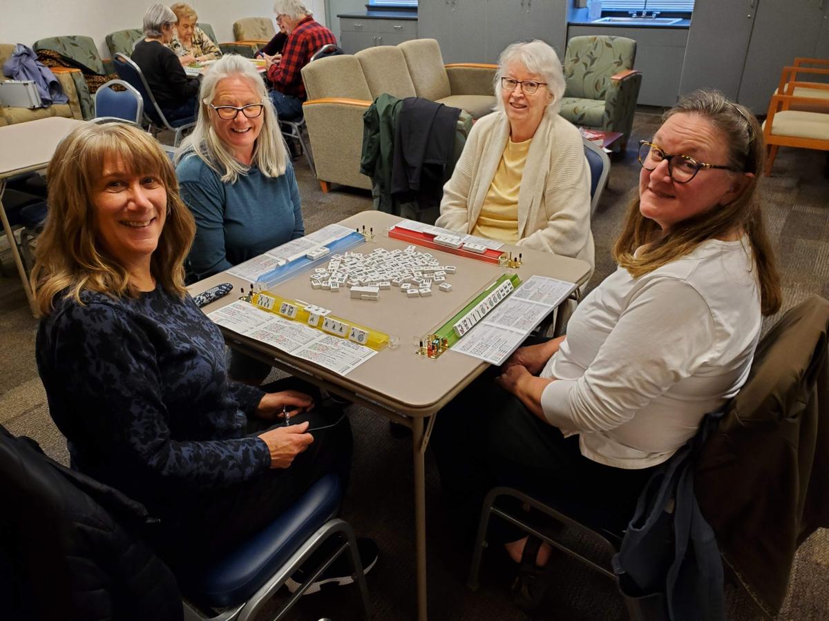 Participants playing mah jongg